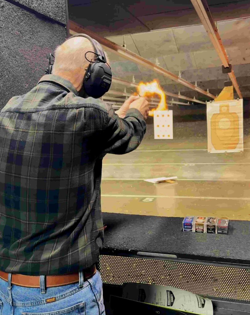 Photo of author rapid firing the revolver.