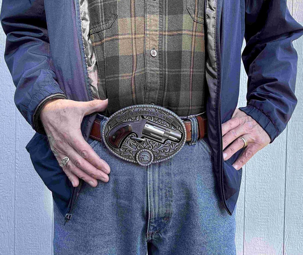 Photo of author wearing the belt buckle gun