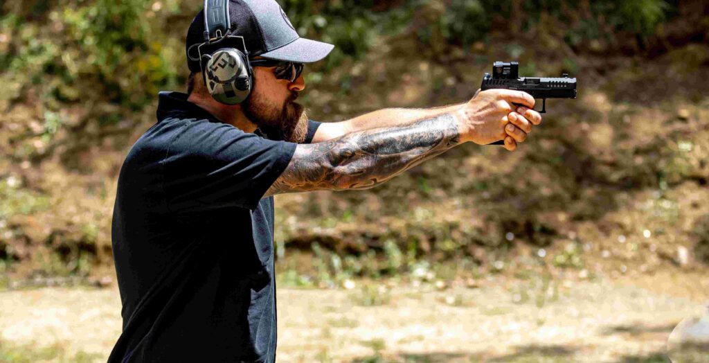 Photo of guy shooting the CZ P10